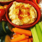 bowl of hummus with vegetables