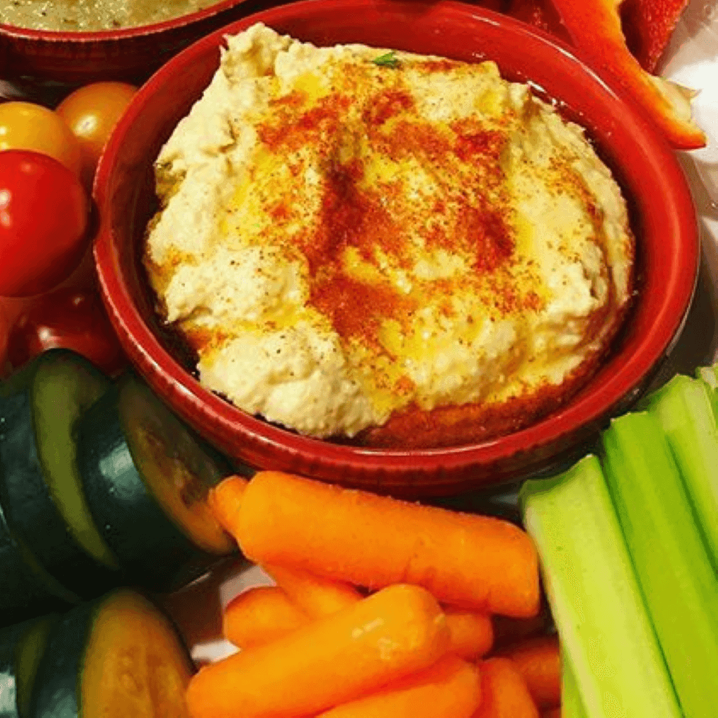 bowl of hummus with vegetables