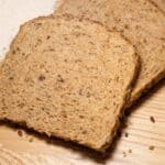 sliced wheat bread on wood cutting board