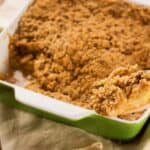 Fresh apple crumble in a green baking dish