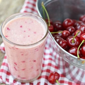 Low oxalate smoothie with bowl of fresh cherries