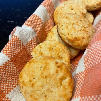Low Sodium Biscuits on orange checkerboard towel in basket