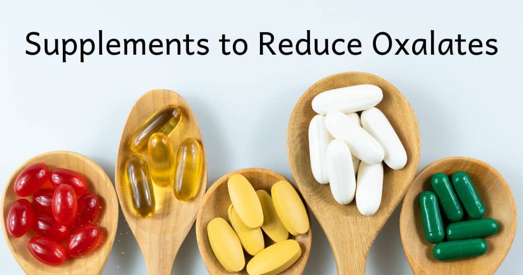Wooden spoons with pills on them with blog title "Supplements to Reduce Oxalates" over the top of image